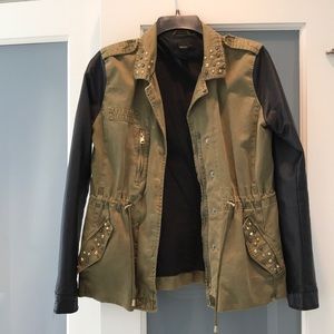 Army green jacket with faux leather sleeves.